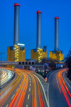 Power station and highway at night seen in Berlin, Germany
