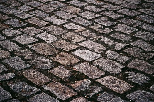 Stone pavement texture, old town street road background.