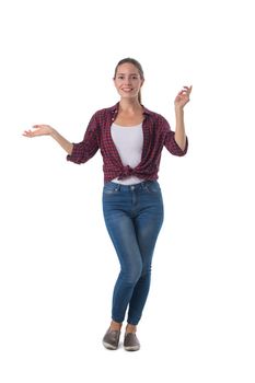 Full length portrait of smiling young woman holding her arm out and showing copy space for product isolated on white background, casual people