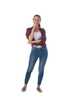 Full length portrait of smiling young woman with her hand on chin isolated on white background, casual people