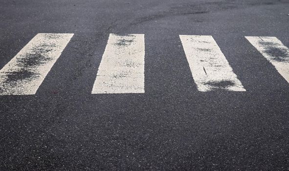 White painted pedestrian zebra crossing on a road in Europe