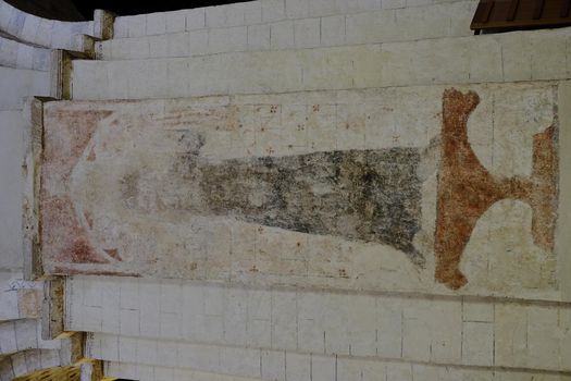 Defaced medieval mural painting of St Sitha in St Albans Cathedral, UK.