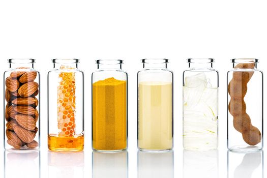 Alternative skin care and homemade scrubs with natural ingredients  in glass bottles isolate on white background.