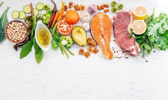 Ketogenic low carbs diet concept. Ingredients for healthy foods selection on white wooden background. Balanced healthy ingredients of unsaturated fats for the heart and blood vessels.