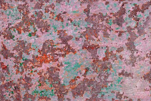 shabby peeled white, orange and green paint layers on concrete surface - flat background and seamless texture.