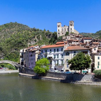 Dolceacqua town. Liguria, Italy The Monet's bridge on the River Nervia. On the hill is located the Doria castle's. Dolceacqua, Imperia (ITALY) - August 15, 2016.