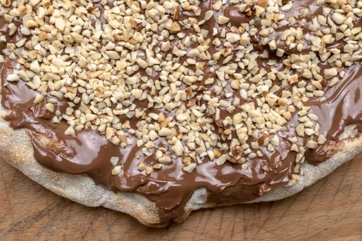 Nutella pizza with hazelnut. Original, fresh, new.