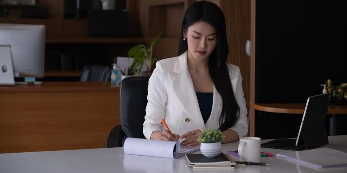 Work from home concept, Asian business woman working with paper work at home office