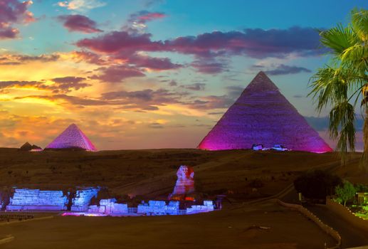 The Pyramids and the Sphinx in the night lights, Giza, Egypt