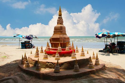 sand pagoda in Songkran festival represents In order to take the sand scraps attached to the feet from the temple to return the temple in the shape of a sand pagoda