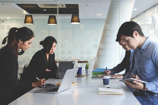 Group of Fund managers researching and analysis Investment stock market by laptop computer