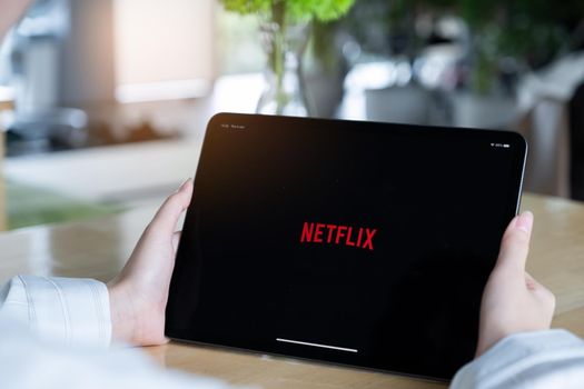 CHIANG MAI, THAILAND : JULY 26, 2020 : Netflix app on ipad screen. Netflix is an international leading subscription service for watching TV episodes and movies.