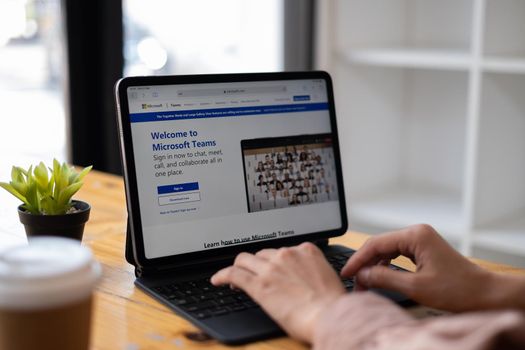 CHIANG MAI, THAILAND - Mar 21, 2021 : Business woman using Microsoft Teams social platform on tablet, ready for remote working in isolation from home