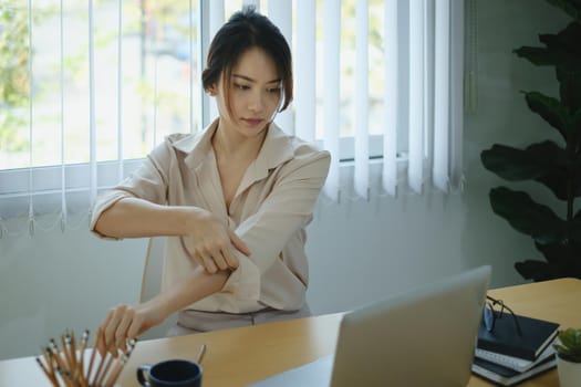 Portrait of woman sitting at her office. Attractive young confident business woman or accountant have idea for her big project