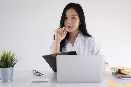 Portrait of Asian Business woman working from home. Accounting concept