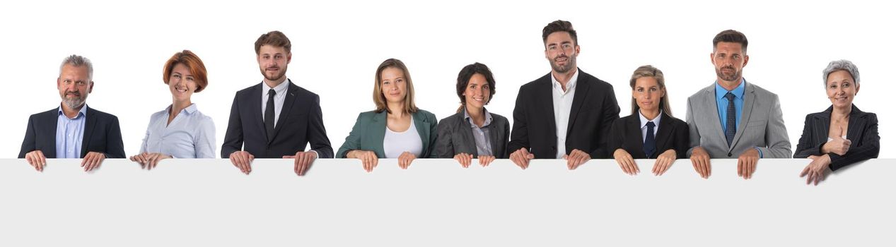 Business people group with blank banner isolated over white
