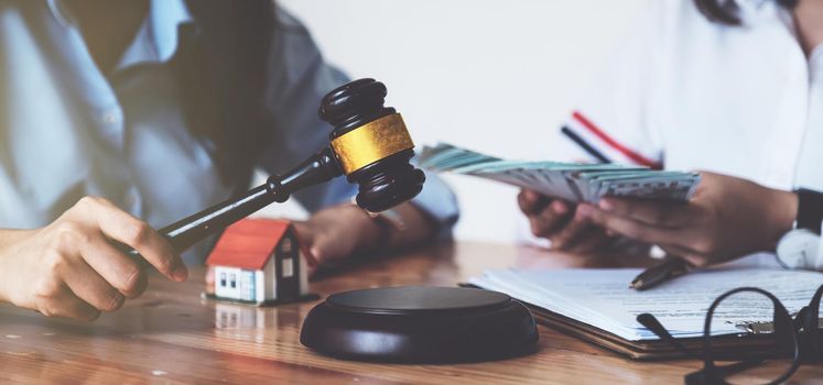 Business woman and lawyers discussing contract papers on wooden desk in office. Law, legal services, advice, Justice concept