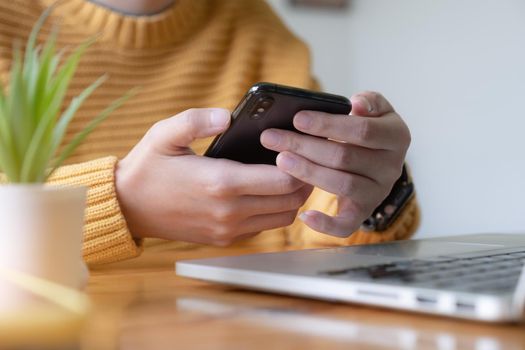 Young asian woman disconnect social and turn off her smartphone. Digital detox concept