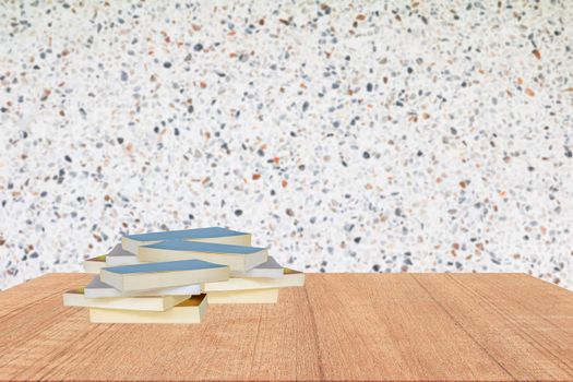 books stack on wooden shelf in library school concept with wall  polished stone blur background copy space add text