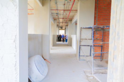 blur interior in construction and wall decoration at building site with engineer