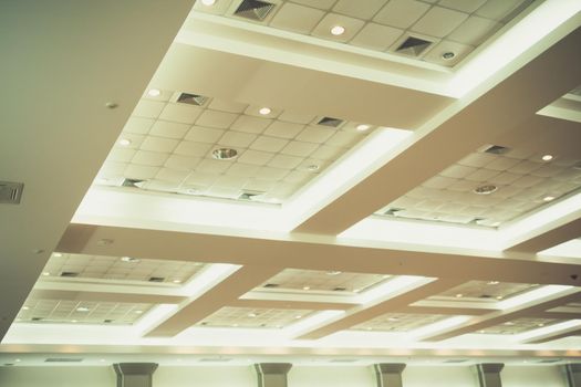 ceiling of business interior office building and light neon. vintage style tone with copy space add text