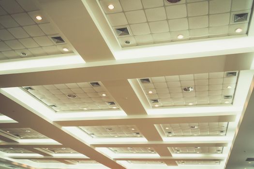 ceiling of business interior office building and light neon. vintage style tone with copy space add text