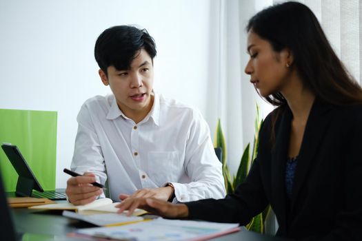 Businessman and team wear mask and try to explain about his work at home office. Work from home concept.