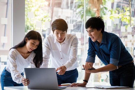 Analytics intelligence concept. Group of business people discuss current financial and economic on laptop for investment at the meeting