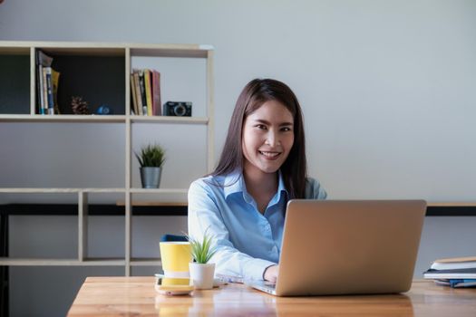 Portrait of Asian Business woman working from home. Accounting concept