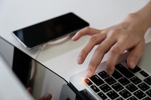 Man press turn off button laptop computer and turn off smartphone Social media disconnect and Technology ban social ban and digital detox concept
