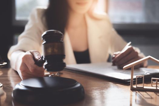 Business woman or lawyers checking contract papers with on wooden desk in office. Law, legal services, advice, Justice concept