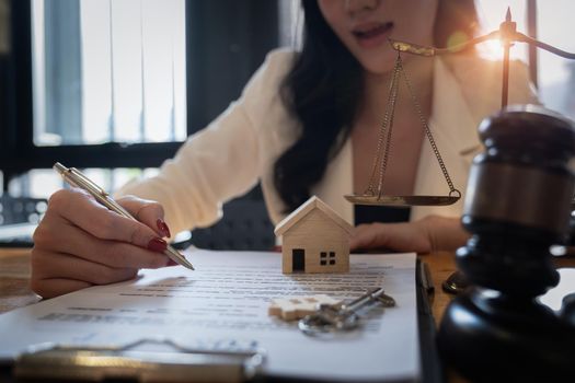 Lawyer checking agreement document before sending to client.