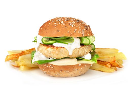Fishburger fish burger with cod cutlet cucumber lettuce goat cheese dzatziki tartarus sauce on grain cereal bread and french fries on plate isolated on white background