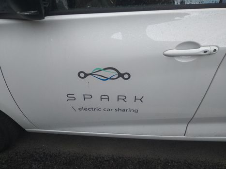 New electric car, white Spark Renault Zoe on street. Car sharing service in Bucharest, Romania, 2021