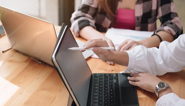 Group of Businesswoman and Accountant checking data document on laptop computer for investigation of corruption account Anti Bribery concept.