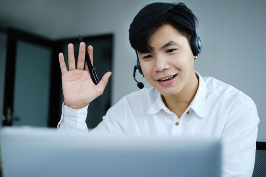 I have a question. Businessman raising their hands while online conference by laptop. Business and Entrepreneurship event