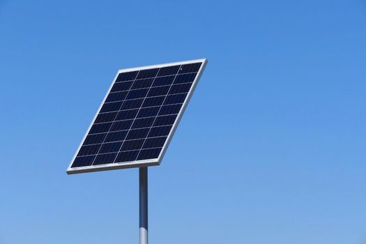 Solar panels or electric battery against the blue sky is isolated. High quality photo