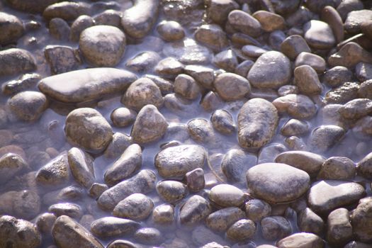 Set of natural stones on the bank of a river. No people