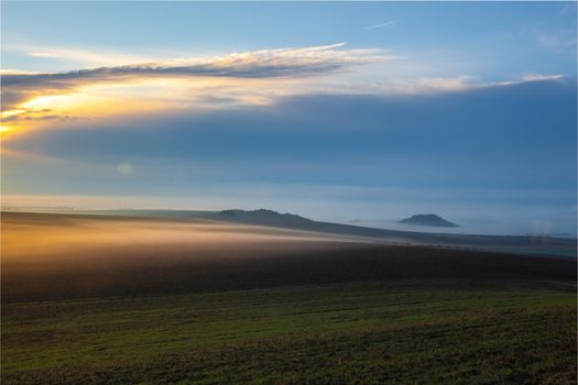 Landscape covered with fog in Central Bohemian Uplands, Czech Republic. Central Bohemian Uplands is a mountain range located in northern Bohemia. The range is about 80 km long