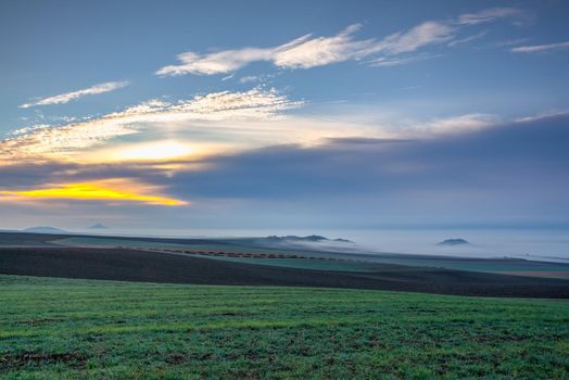 Landscape covered with fog in Central Bohemian Uplands, Czech Republic. Central Bohemian Uplands is a mountain range located in northern Bohemia. The range is about 80 km long