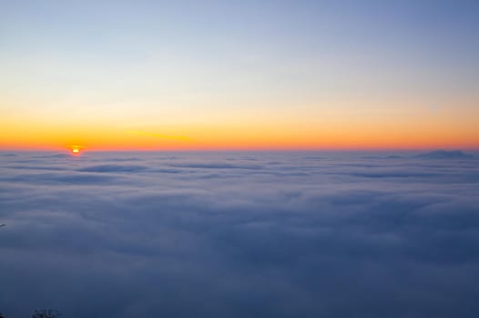 Amazing sunrise above clouds from the top of the mountain in Central Bohemian Uplands, Czech Republic