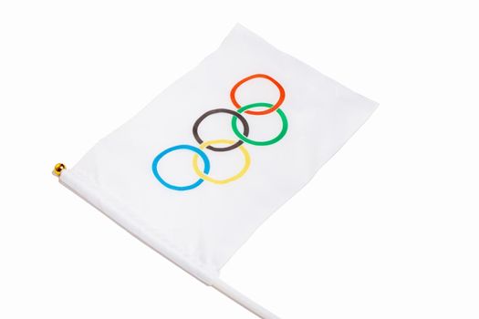 Miniature Olympic flag on a white background. Olympic Games symbol. Moscow Russia 7 April 2021