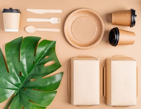 Knolling concept. Eco friendly zero waste disposable tableware top view flat lay on brown background