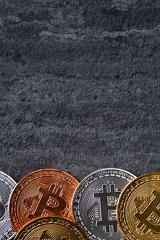 Top view business concept of bitcoin cryptocurrency money on dark black slate table background.
