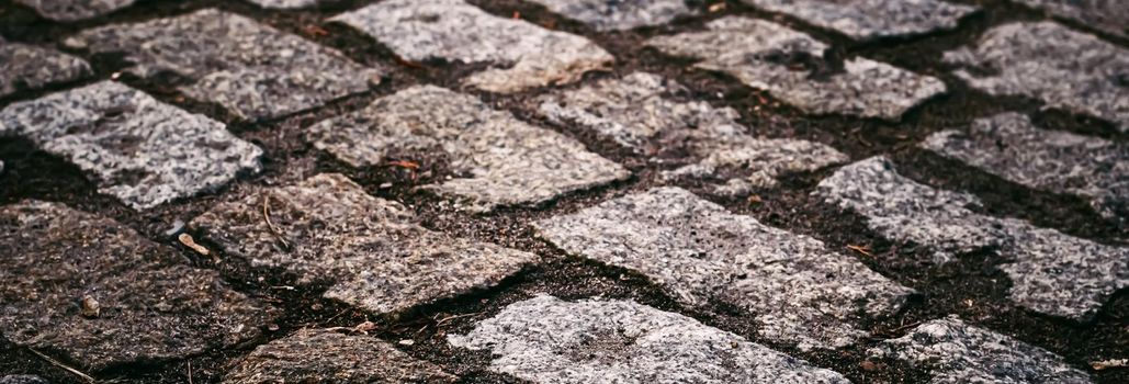 Stone pavement texture, old town street road background.