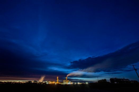 Ominous Storm Clouds Prairie night refinery Fertilizer