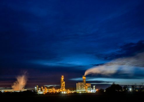 Ominous Storm Clouds Prairie night refinery Fertilizer