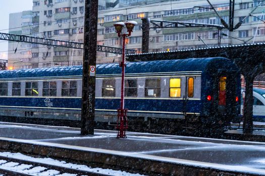 Winter detail train view. Train on the platform of Bucharest North Railway Station (Gara de Nord Bucuresti) in Bucharest, Romania, 2021