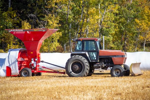 Grain Bag Saskatchewan tractor filling crop Canada