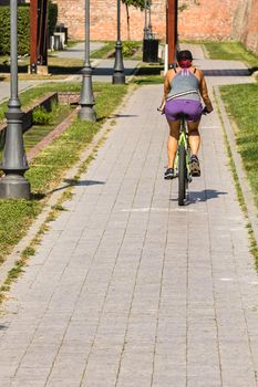 Riding the bicycle on sunny day in Alba Iulia, Romania, 2021